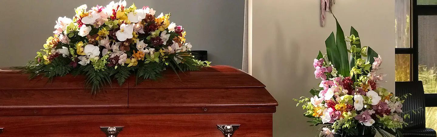 Casket with floral arrangements